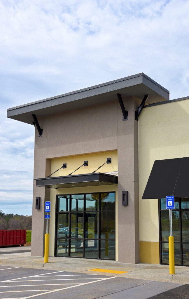 A front view of newly built and painted commercial building. Color tone is more on neutral color tone
