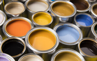 numerous cans of best quality exterior paint in many colors